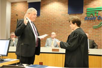 Swearing in Supervisor John D. Maxwell.