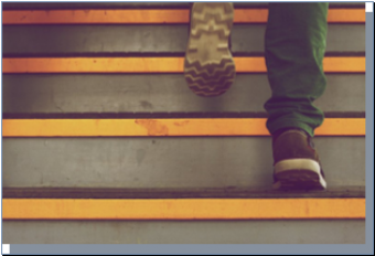 Image of person walking up stairs