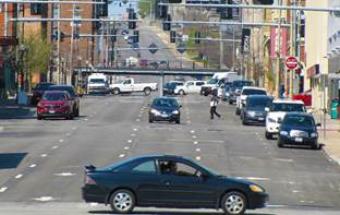 A street view of cars and traffic.