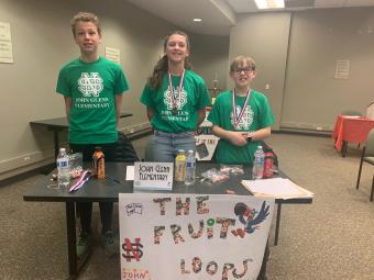 Photograph of 6th graders wearing medals