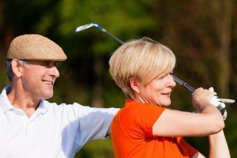 couple with a golf club