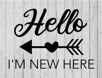 "Hello, I'm New Here" written in black on wood sign.