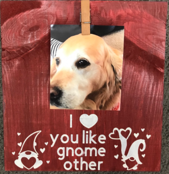 Wooden board painted red, with photo of a golden retriever and the phrase "I love you like gnome other"