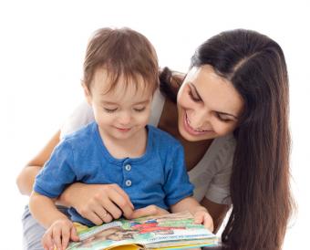 This is an adult and child with a book