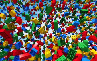 LEGO bricks falling from a blue sky.