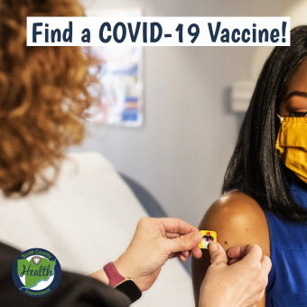 Find a COVID-19 vaccine message with physician putting a bandaid on a patient