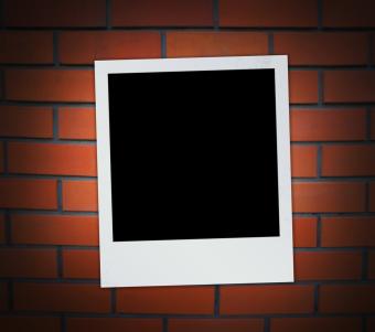 polaroid photo with brick background