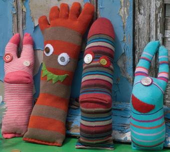 Photo of socks with sewn on eyes and fangs.