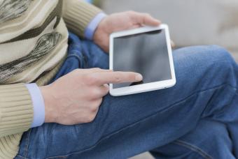 This is a man holding a tablet