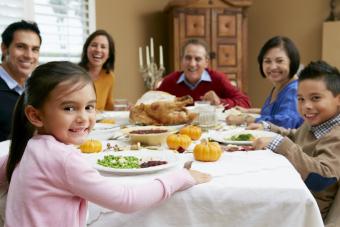 This is a family sharing a meal around a table.