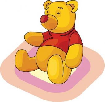 Winnie the Pooh sitting on a rug.