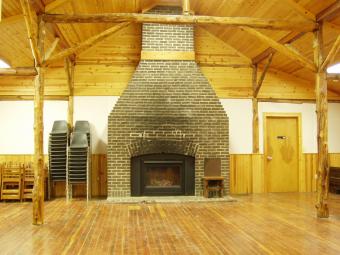 Stone fireplace inside redtail Lodge.