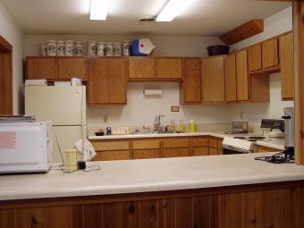 The kitchen has a serving counter.