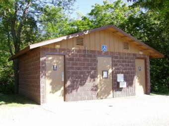 Restrooms located near the shelter.