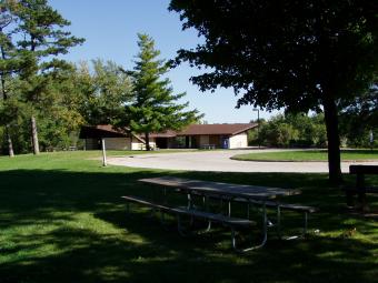 Whispering Pines shelter behind the trees.