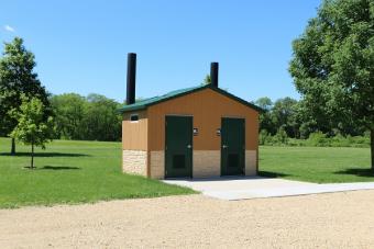 Restrooms located near the shelter.
