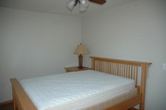 A bedroom at Summit Cabin with a queen bed. ADA Accessible.