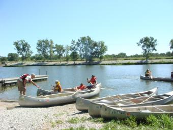 Kayaks collecting along the shore