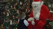 Little girl speaking to Santa.