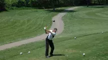Golfer preparing swing.