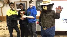 photo of chili cook off winners with smokey the bear