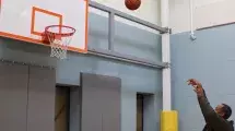 Harlee Miller shoots a basketball.