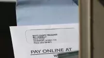 A mailbox with letters and bills.