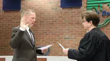 Swearing in Treasurer Mike Fennelly.