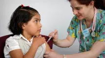 Child receiving immunization in arm