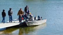 photo of people on a boat at the fishing dock