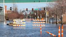 Road closed barricades flooded in water on River Drive.