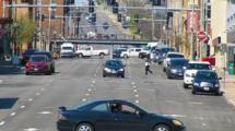 A street view of cars and traffic.