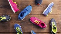Image of multiple pairs of walking shoes laying on floor