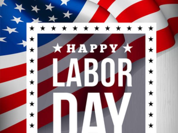 This is a flag with the words Happy Labor Day over it. 