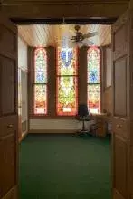 Stained glass windows inside the bell tower suite.