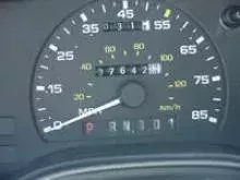 The dashboard of a car including the odometer.